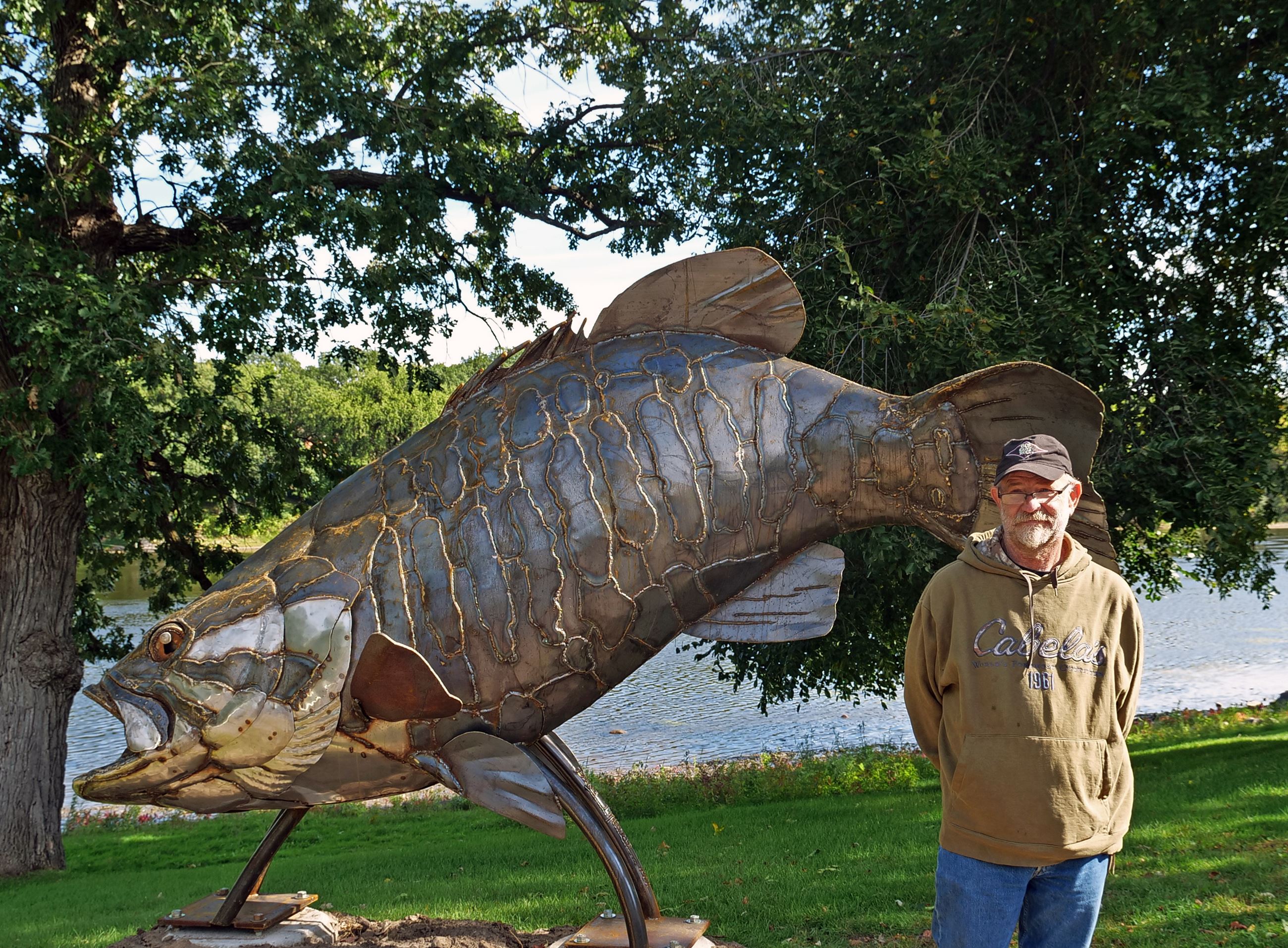  Parker McDonald standing with his Bass Sculpture