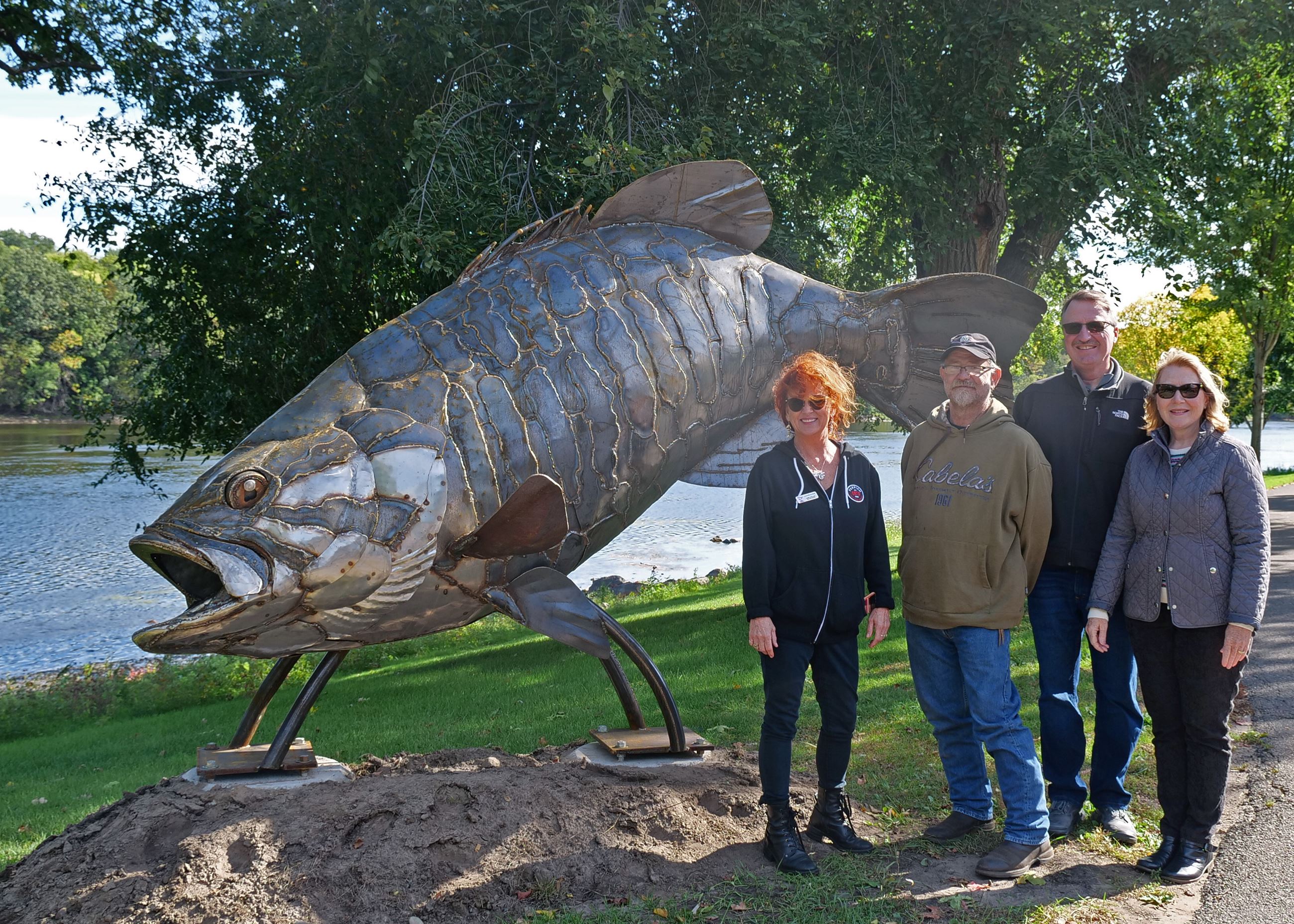  Parker McDonald standing with his Bass Sculpture and the project's donors: CMAB, and the Ellison