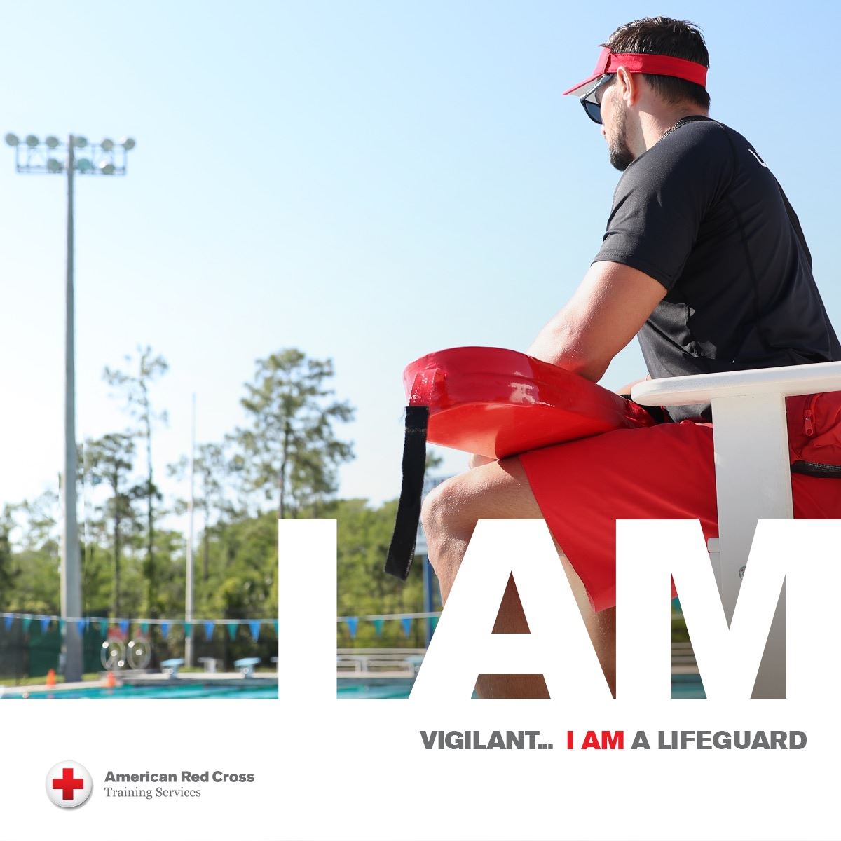 Lifeguard watching an outdoor pool 